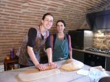Two of the sisters making bread