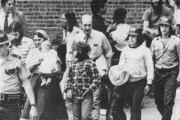 Lawyer and children near courthouse