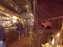 take a seat at a cozy booth or on the bar stools